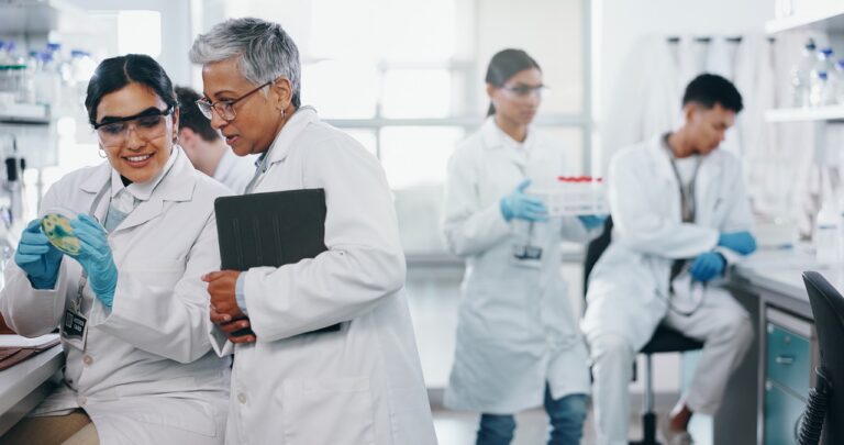 Healthcare IT director reviewing laboratory interoperability stack diagram showing HL7, FHIR, HIE, and Lane secure fax integration with LIS and EHR systems
