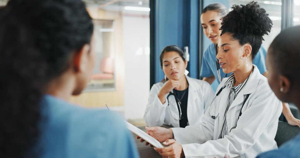 hospital administrator reviewing why fax remains embedded in healthcare communication
