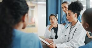 hospital administrator reviewing why fax remains embedded in healthcare communication