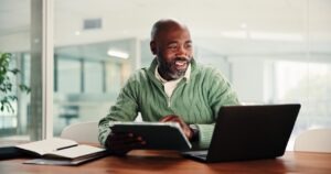 Healthcare billing staff reviewing a faxed prior authorization request and response