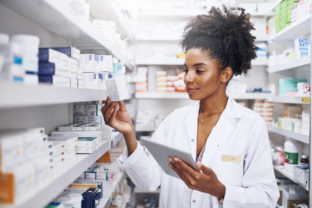 Hospital pharmacist reviewing a faxed medication order for verification