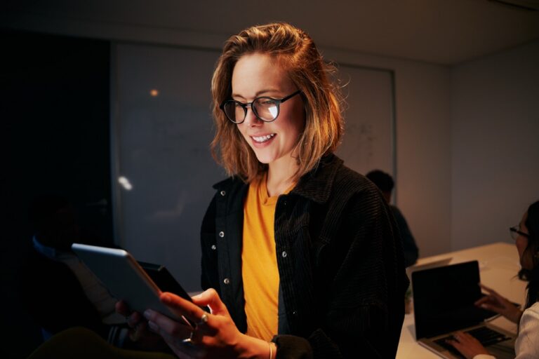 IT compliance officer reviewing a fax compliance program checklist covering encryption, vendors, and audit trail