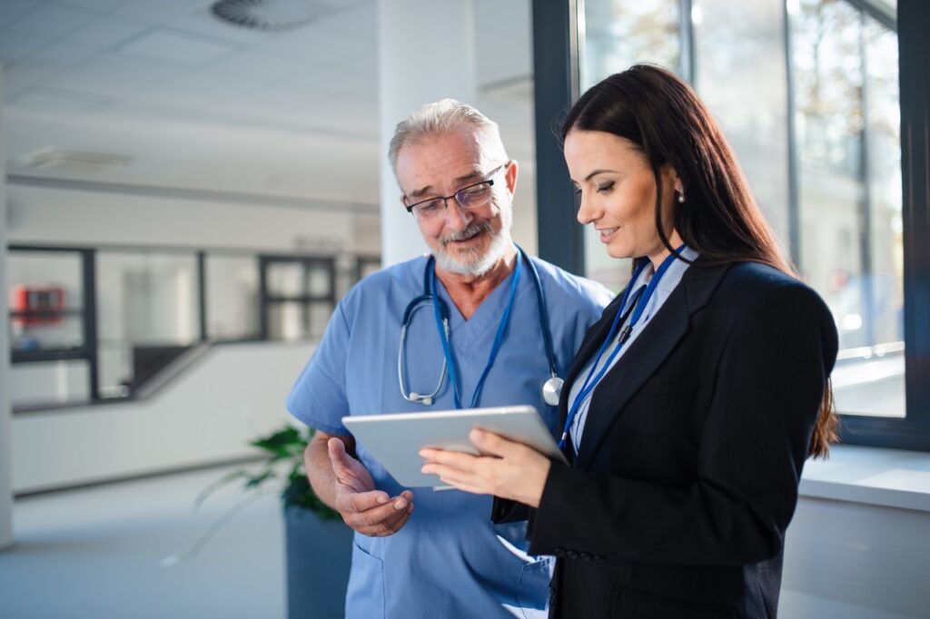 Healthcare compliance officer reviewing a HIPAA fax audit trail on screen